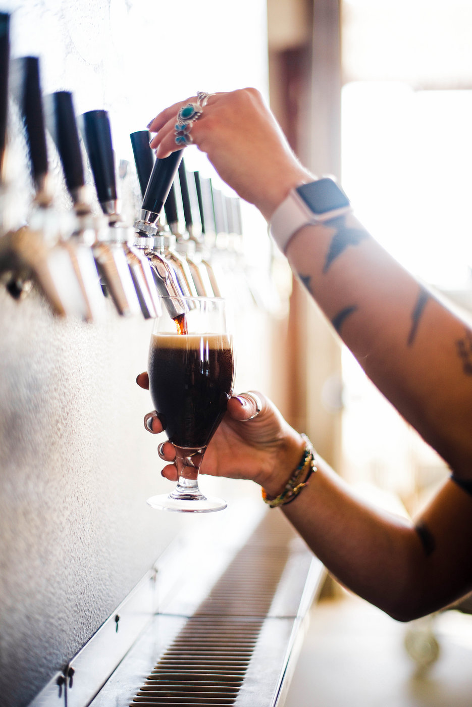 Pouring a fresh beer at Glasstown Brewing